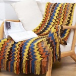 Knitted sofa blanket with tassels
